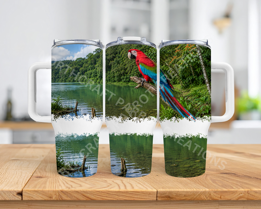 Green-winged (Greenwing) Macaw on branch with Lake 40oz Stainless Steel Parrot Tumbler